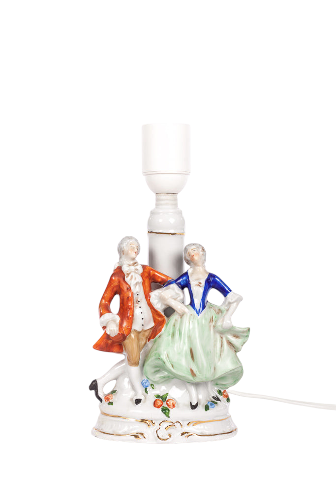 Liten porslinslampa med figuriner
